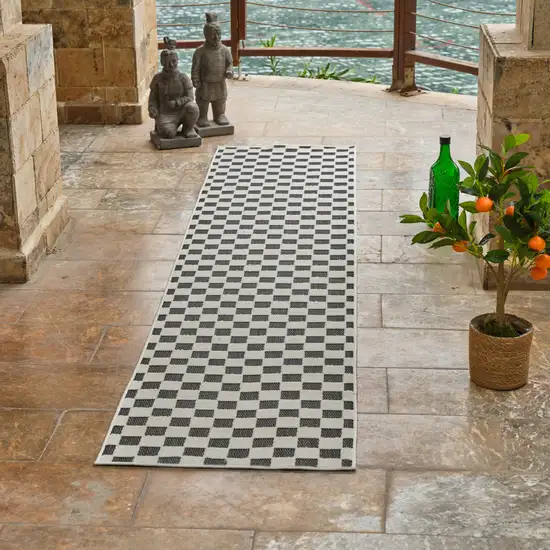 8' Black and White Geometric Distressed Indoor Outdoor Runner Rug Photo 8