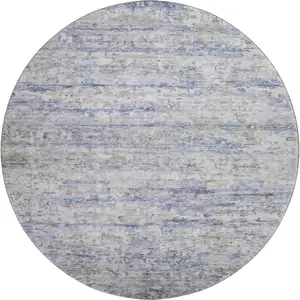 Photo of 8' Blue And Beige Striped Washable Round Rug With UV Protection