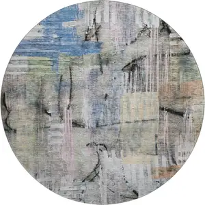 Photo of 8' Blue And Black Abstract Washable Round Rug With UV Protection