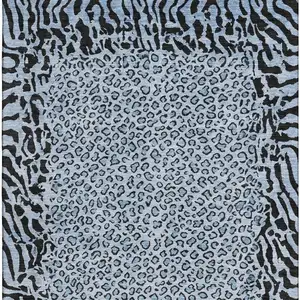 Photo of 8' Blue And Black Animal Print Washable Area Rug With UV Protection