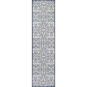 Photo of 10' Blue And Cream Geometric Indoor Outdoor Runner Rug