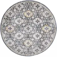 Photo of 6' Blue And Gold Round Floral Stain Resistant Area Rug