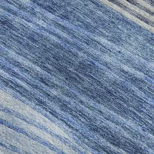 Photo of 8' Blue And Gray Striped Washable Round Rug With UV Protection