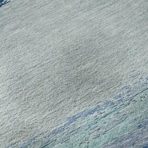 Photo of 8' Blue And Ivory Abstract Washable Area Rug With UV Protection