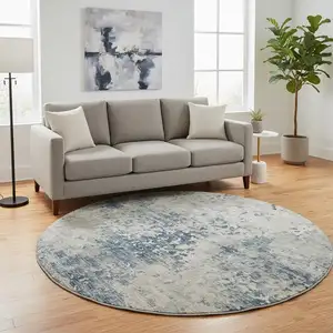 Photo of 8' Blue And Ivory Abstract Washable Round Rug With UV Protection