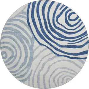 Photo of 8' Blue And Ivory Abstract Washable Round Rug With UV Protection
