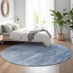 Photo of 8' Blue And Ivory Abstract Washable Round Rug With UV Protection