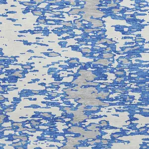 Photo of 8' Blue And Ivory Abstract Washable Round Rug With UV Protection