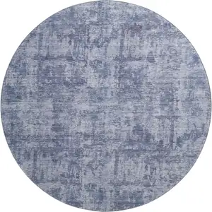 Photo of 8' Blue And Ivory Abstract Washable Round Rug With UV Protection