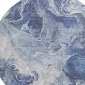 Photo of 8' Blue And Ivory Abstract Washable Round Rug With UV Protection