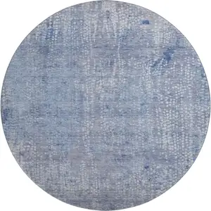 Photo of 8' Blue And Ivory Abstract Washable Round Rug With UV Protection