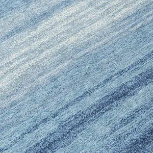 Photo of 8' Blue And Ivory Round Striped Washable Indoor Outdoor Area Rug