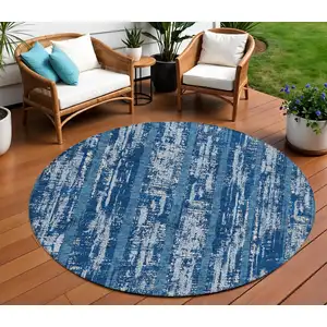 Photo of 8' Blue And Ivory Round Striped Washable Indoor Outdoor Area Rug
