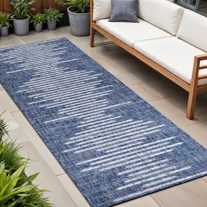 Photo of 10' Blue And Ivory Striped Indoor Outdoor Runner Rug