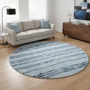 Photo of 8' Blue And Ivory Striped Washable Round Rug With UV Protection