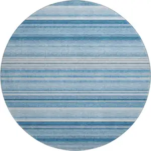 Photo of 8' Blue And Ivory Striped Washable Round Rug With UV Protection