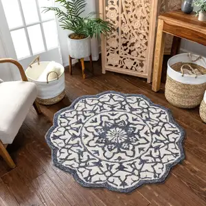 Photo of 6' Blue And Ivory Wool Medallion Hand Tufted Round Rug