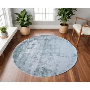 Photo of 8' Blue And Silver Round Shag Tufted Handmade Area Rug