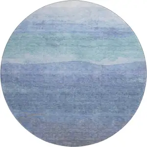 Photo of 8' Blue And Teal Striped Washable Round Rug With UV Protection