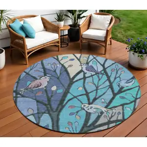 Photo of 8' Blue Beige And Khaki Round Botanical Leaves Washable Indoor Outdoor Area Rug