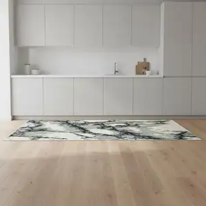 Photo of 8' Blue Black And Ivory Abstract Runner Rug With Fringe