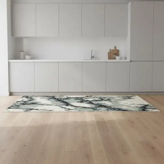 8' Blue Black And Ivory Abstract Runner Rug With Fringe Photo 1