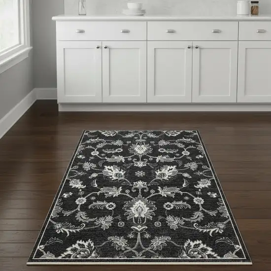 8' Blue Black And Ivory Floral Runner Rug With Fringe Photo 1