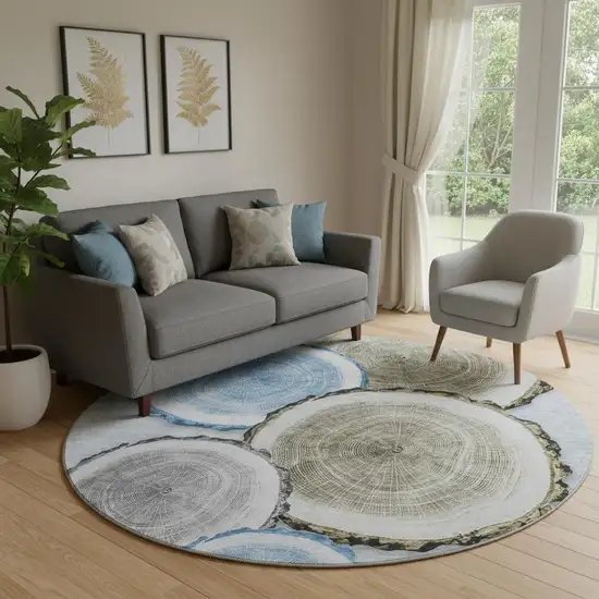 8' Blue Brown And Ivory Woodland Lodge Washable Round Rug With UV Protection Photo 1
