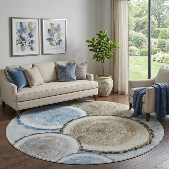 8' Blue Brown And Ivory Faux Bois Washable Round Rug With UV Protection Photo 1