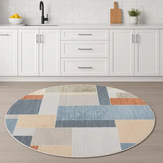 5' Blue Brown And Tan Geometric Round Rug Photo 1