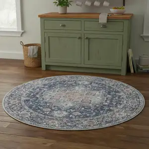 Photo of 4' Blue Floral Power Loom Worn Faded Round Rug