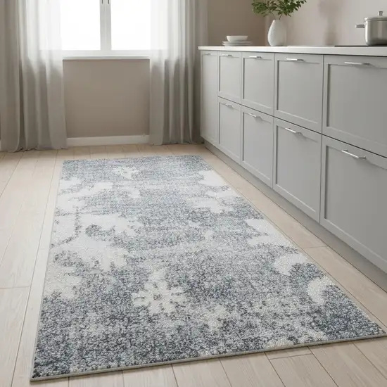 8' Blue Floral Power Loom Worn Faded Runner Rug Photo 1