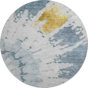 Photo of 8' Blue Gold And Ivory Abstract Washable Round Rug With UV Protection