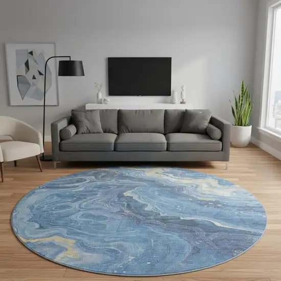 8' Blue Gold And Ivory Abstract Washable Round Rug With UV Protection Photo 2