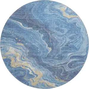 Photo of 8' Blue Gold And Ivory Abstract Washable Round Rug With UV Protection