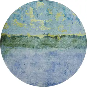 Photo of 8' Blue Gold And Ivory Abstract Washable Round Rug With UV Protection