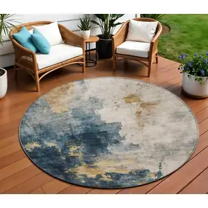 Photo of 8' Blue Gray And Gold Round Abstract Washable Indoor Outdoor Area Rug