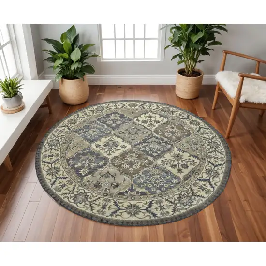 8' Gray Ivory And Blue Wool Floral Hand Tufted Round Rug Photo 1