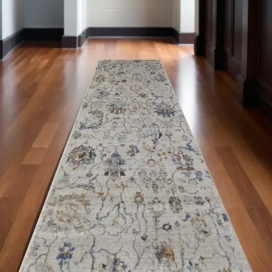 12' Blue Gray and Brown Floral Power Loom Worn Faded Runner Rug With Fringe Photo 1