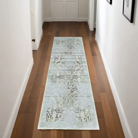 8' Blue Gray and Green Floral Power Loom Worn Faded Runner Rug Photo 1