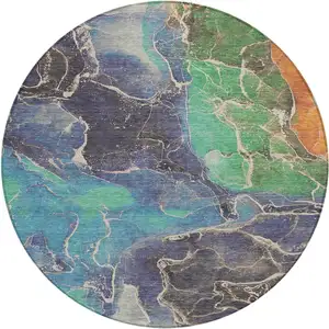 Photo of 8' Blue Green And Orange Round Abstract Washable Indoor Outdoor Area Rug