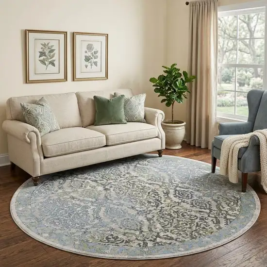 8' Blue Green and Gray Floral Power Loom Worn Faded Round Rug Photo 1