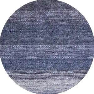 Photo of 8' Blue Ivory And Beige Abstract Washable Round Rug With UV Protection