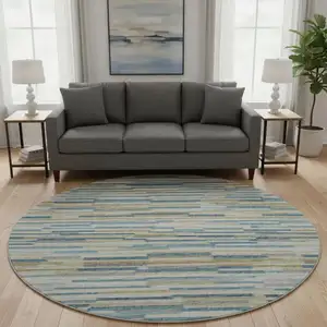 Photo of 8' Blue Ivory And Gold Abstract Washable Round Rug With UV Protection