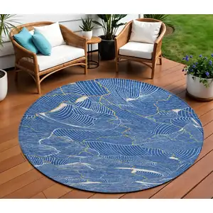 Photo of 8' Blue Ivory And Gold Round Abstract Washable Indoor Outdoor Area Rug