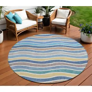 Photo of 8' Blue Ivory And Gold Round Striped Washable Indoor Outdoor Area Rug