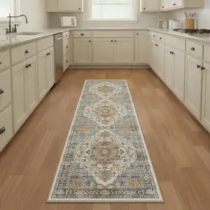 Photo of 8' Blue Ivory And Orange Medallion Distressed Washable Runner Rug