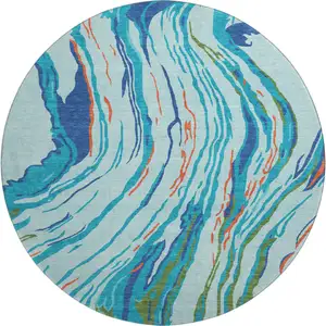 Photo of 8' Blue Orange And Green Abstract Washable Round Rug With UV Protection
