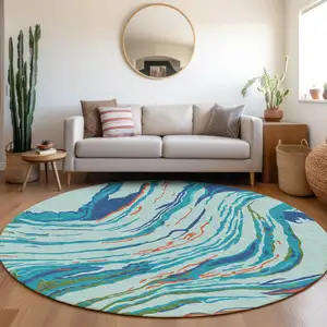 Photo of 8' Blue Pink And Green Round Abstract Washable Indoor Outdoor Area Rug