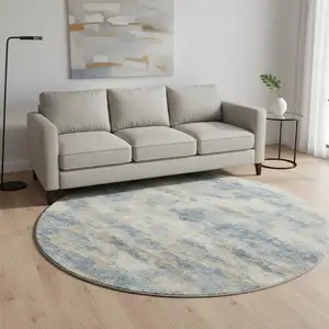 Photo of 8' Blue Silver And Gold Abstract Washable Round Rug With UV Protection